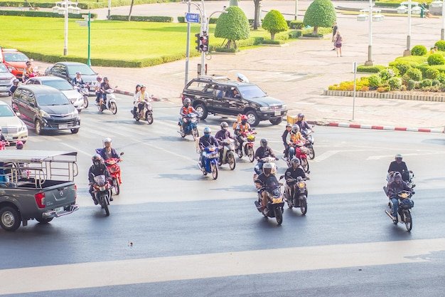 Aerial view of riders crossing a busy city intersection